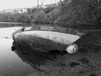 Abandoned boat in sea