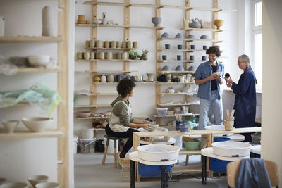 Male and female students in art class