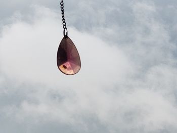 Low angle view of decoration hanging against sky