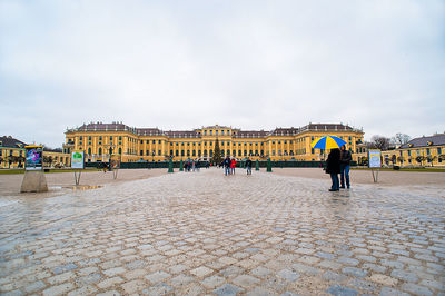 Group of people in front of historical building