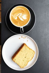 High angle view of cappuccino served on table