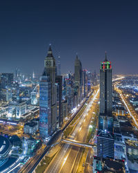 High angle view of dubai lit up at night