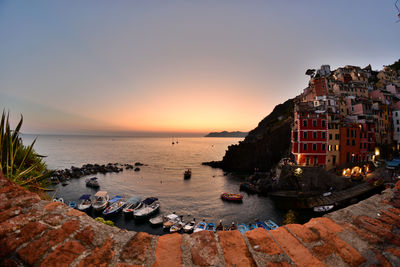 Scenic view of sea against clear sky during sunset
