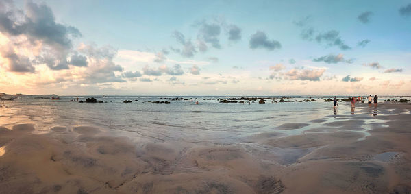 Scenic view of beach against sky during sunset
