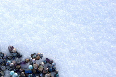 Directly above shot of beads in snow