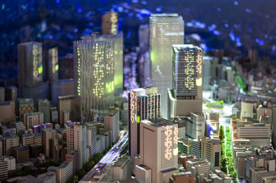 High angle view of illuminated buildings in city at night