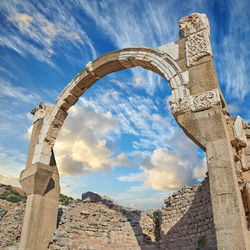 Low angle view of old ruins against sky