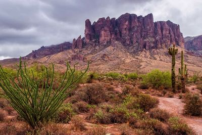 Scenic view of rocky mountains  in desert against sky