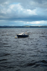 Boat in sea against sky