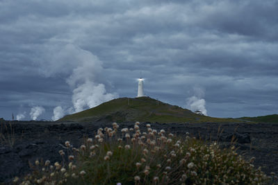 Picturesque scenery of beacon on hill in stormy day