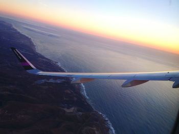 Scenic view of sea against sky at sunset