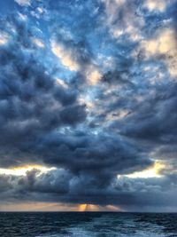 Scenic view of sea against dramatic sky