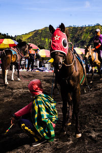 People riding horses on field