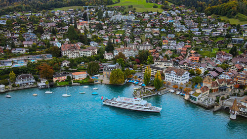 High angle view of townscape by sea