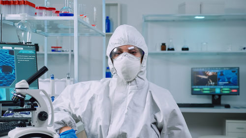 Portrait of scientist wearing mask in laboratory