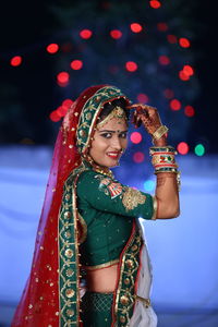 Side view portrait of smiling bride during wedding ceremony