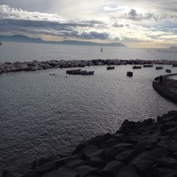 Scenic view of sea against cloudy sky