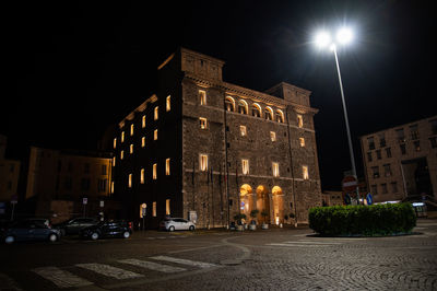 Low angle view of illuminated buildings at night