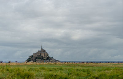 Church on field against sky