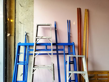 Empty chairs and table against wall at home