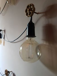 Low angle view of light bulb hanging