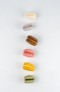 Macarons in action on white background