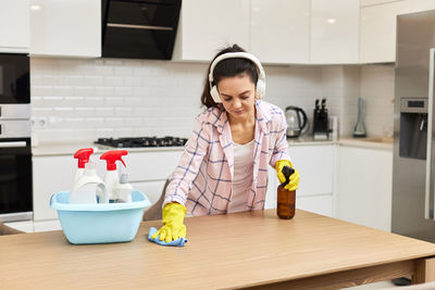 Female dentist in kitchen