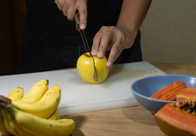 Midsection of man preparing food