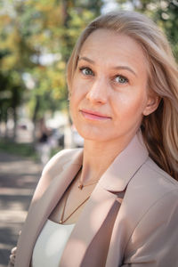 Portrait of a successful business woman with blonde long hair. 