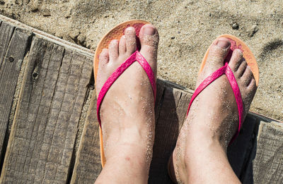 Low section of woman legs on beach