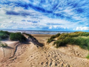 Scenic view of beach against sky