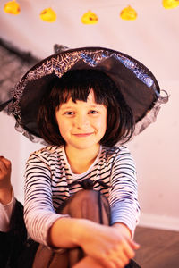 Halloween kids. portrait of a cute girl in a witch's hat. tricks or treats.