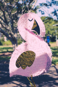 Flamingo shape artwork on footpath at park