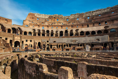 View of the seating areas and the hypogeum of the ancient colosseum in rome
