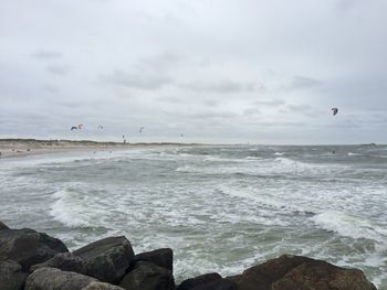 View of calm sea against cloudy sky