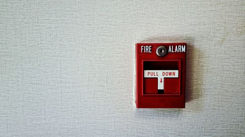 Fire alarm on an interior wall