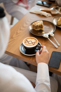 High angle view of coffee cup on table