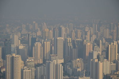 High angle view of buildings in city against sky