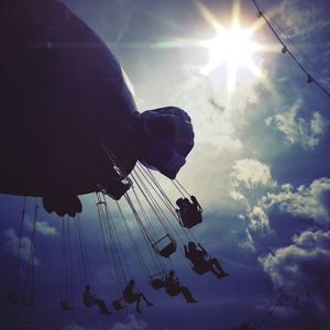 Low angle view of amusement park ride against sky
