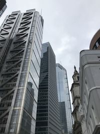 Low angle view of modern buildings against sky in city