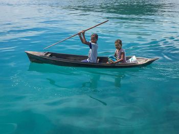 People in boat on sea