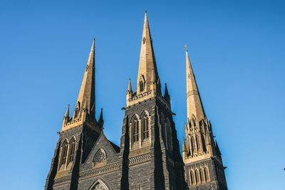 Low angle view of temple against blue sky