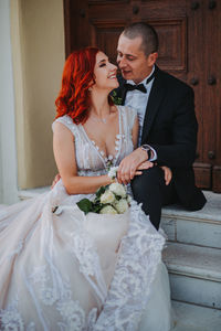 Couple holding flower bouquet