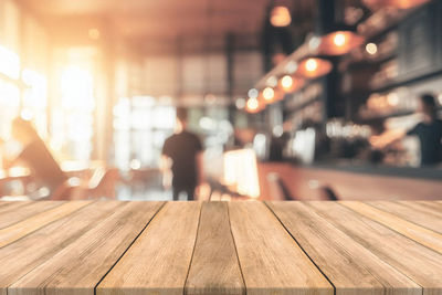 Close-up of wooden table in restaurant