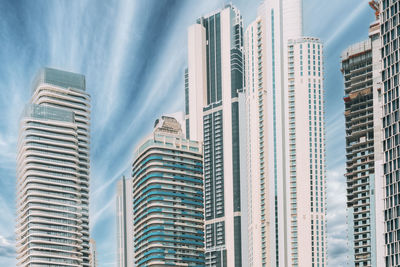 Low angle view of modern buildings against sky