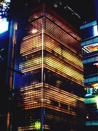 Low angle view of illuminated building at night