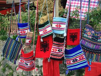 Woolen purses hanging from market stall