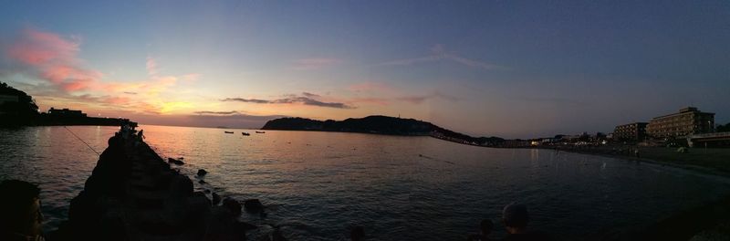 Panoramic view of calm sea at sunset