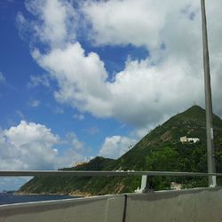 Scenic view of mountains against cloudy sky