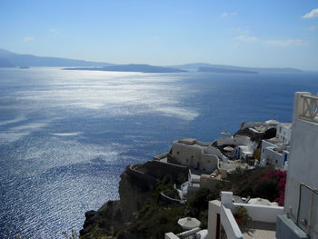 High angle view of sea and buildings against sky